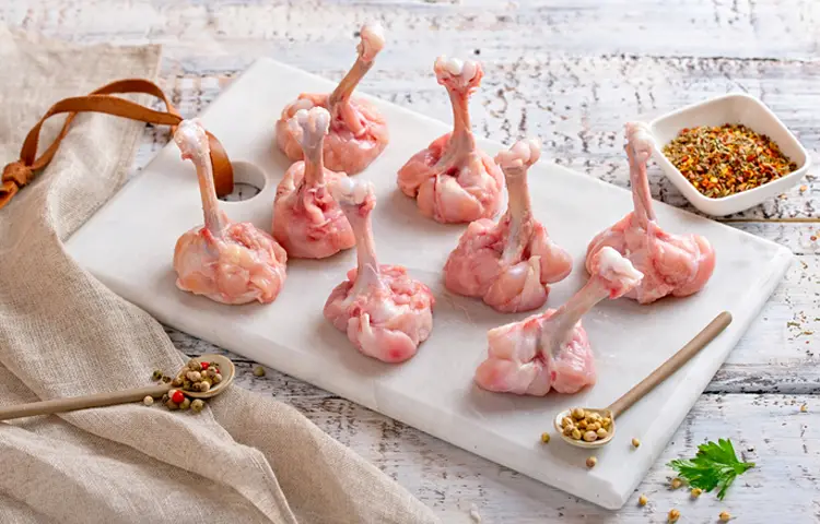 CHICKEN LOLLIPOP RECIPE | CRISPY & DELICIOUS APPETIZER IDEA 3 "Raw chicken lollipops on a marble board with spices."