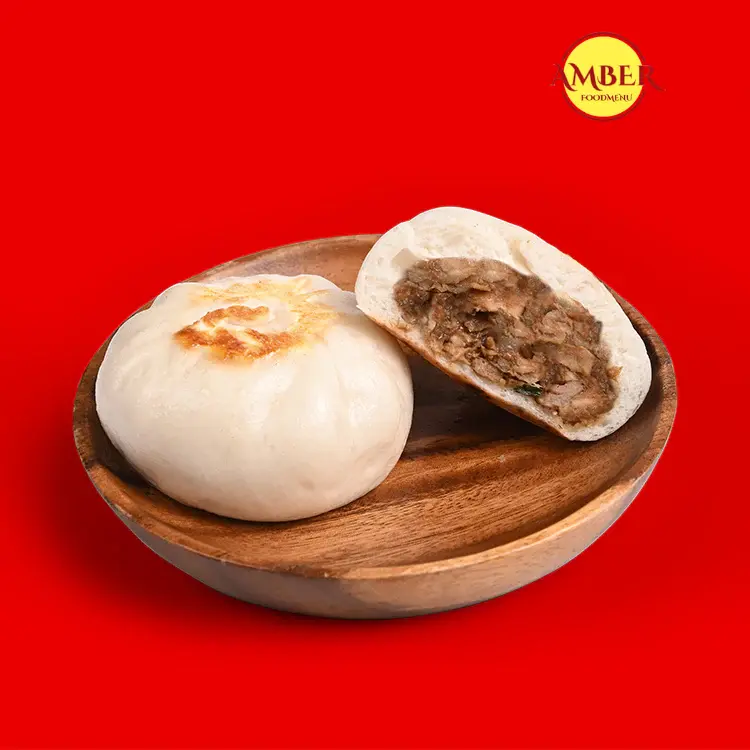 "Pork Asado Siopao Recipe: A Filipino Favorite" 4 "Steamed Pork Asado Siopao buns."
